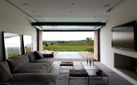 TV room into the cantilevered volume with the swimming pool in t