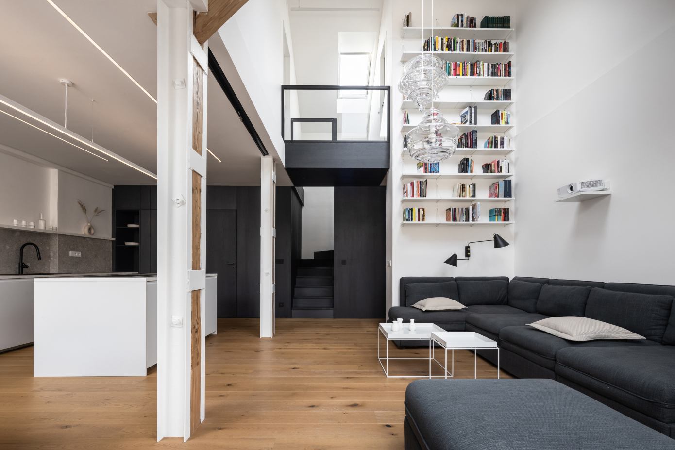 Attic Apartment with a Black Box by Komon Architekti
