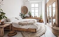 White wall, eco wooden mirror, and flower pots in a large bedroom. Rustic bohemian bedroom. Generative AI