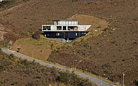 006-casa-egs-concrete-elegance-steep-slopes-stunning-views