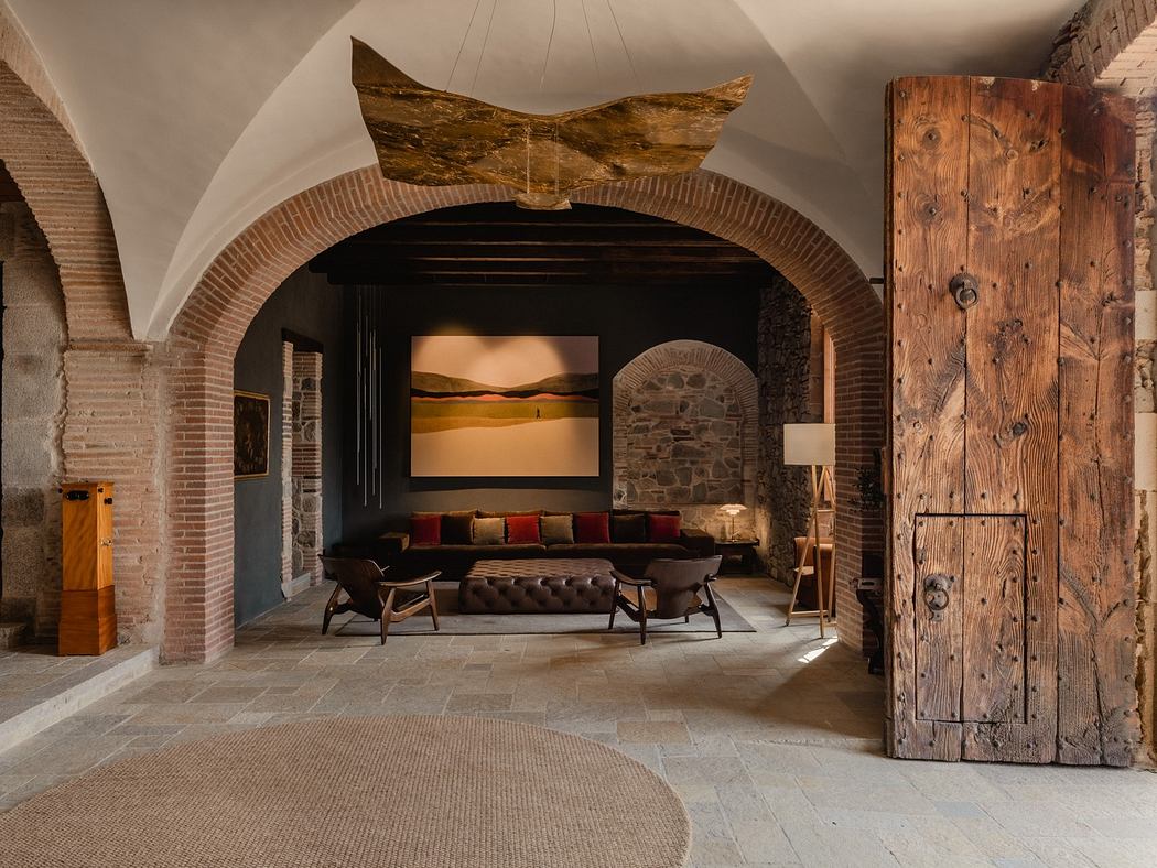 Rustic interior with vaulted ceilings, stone walls, and modern furnishings.