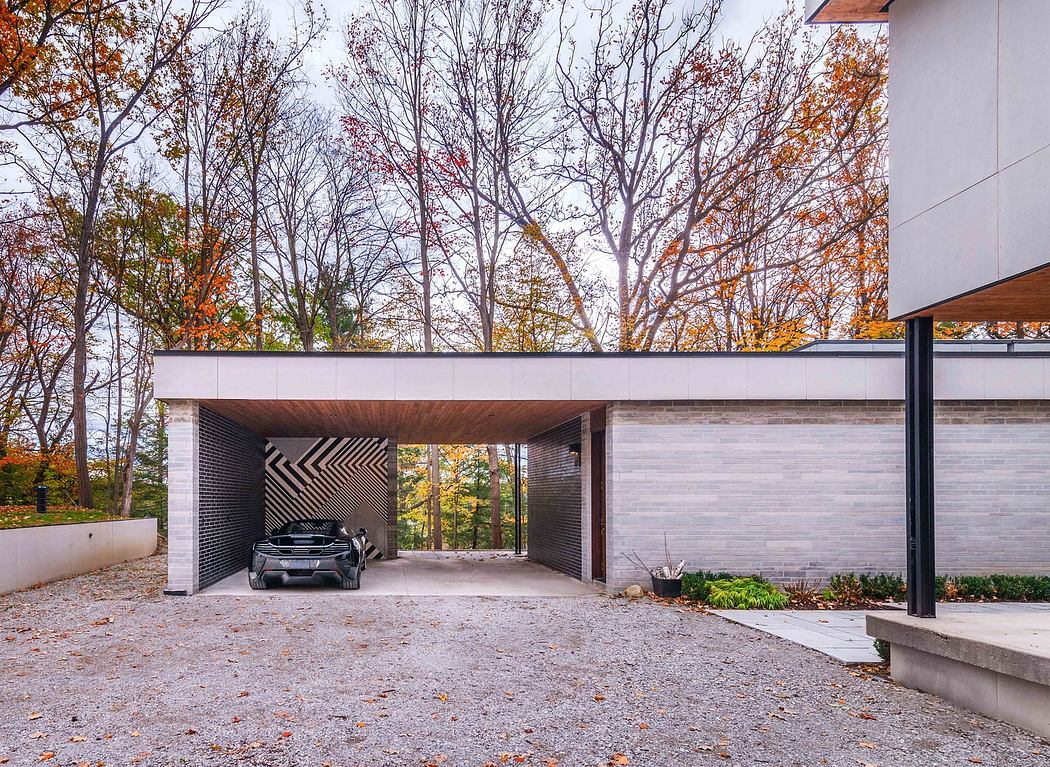 Modern house with geometric carport and fall foliage.