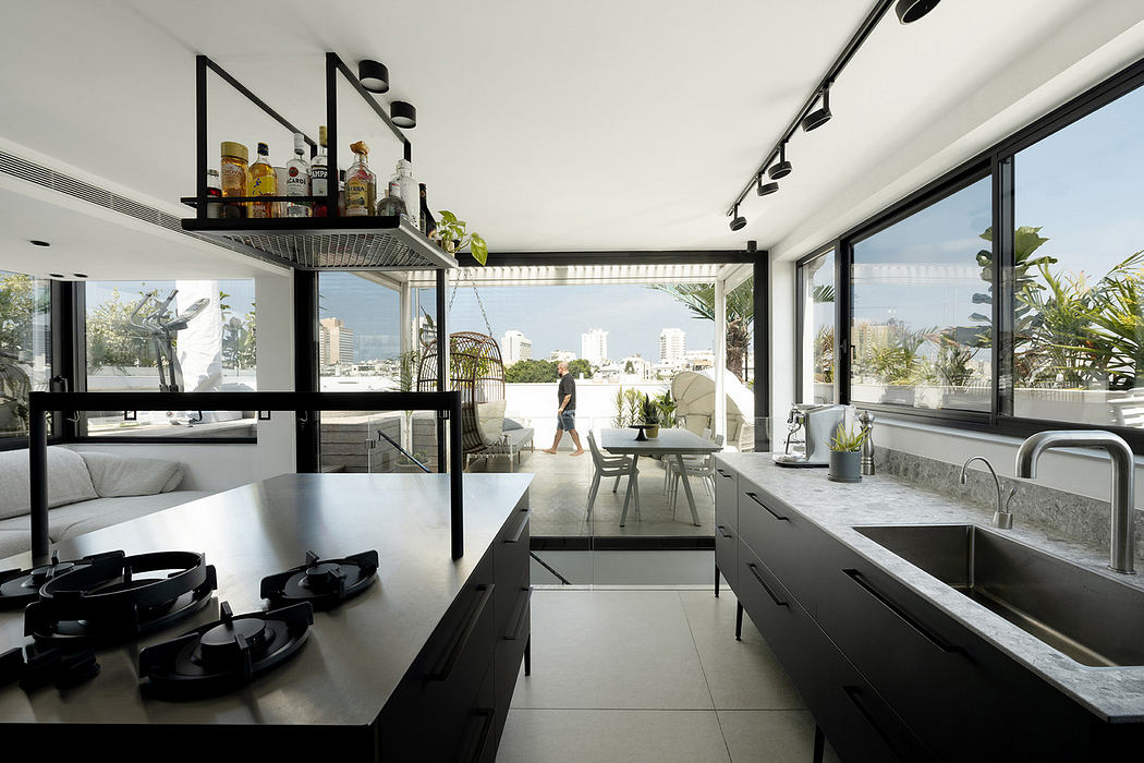Modern kitchen with floor-to-ceiling windows and cityscape view.