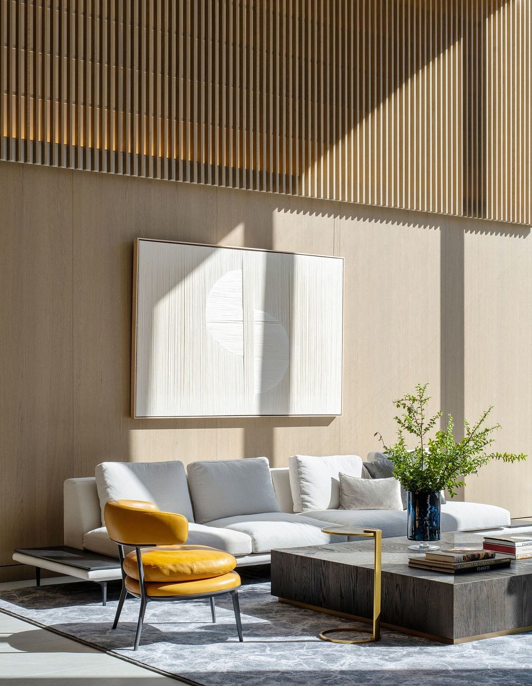 Modern living room with wooden slatted walls, a white sofa, and a yellow