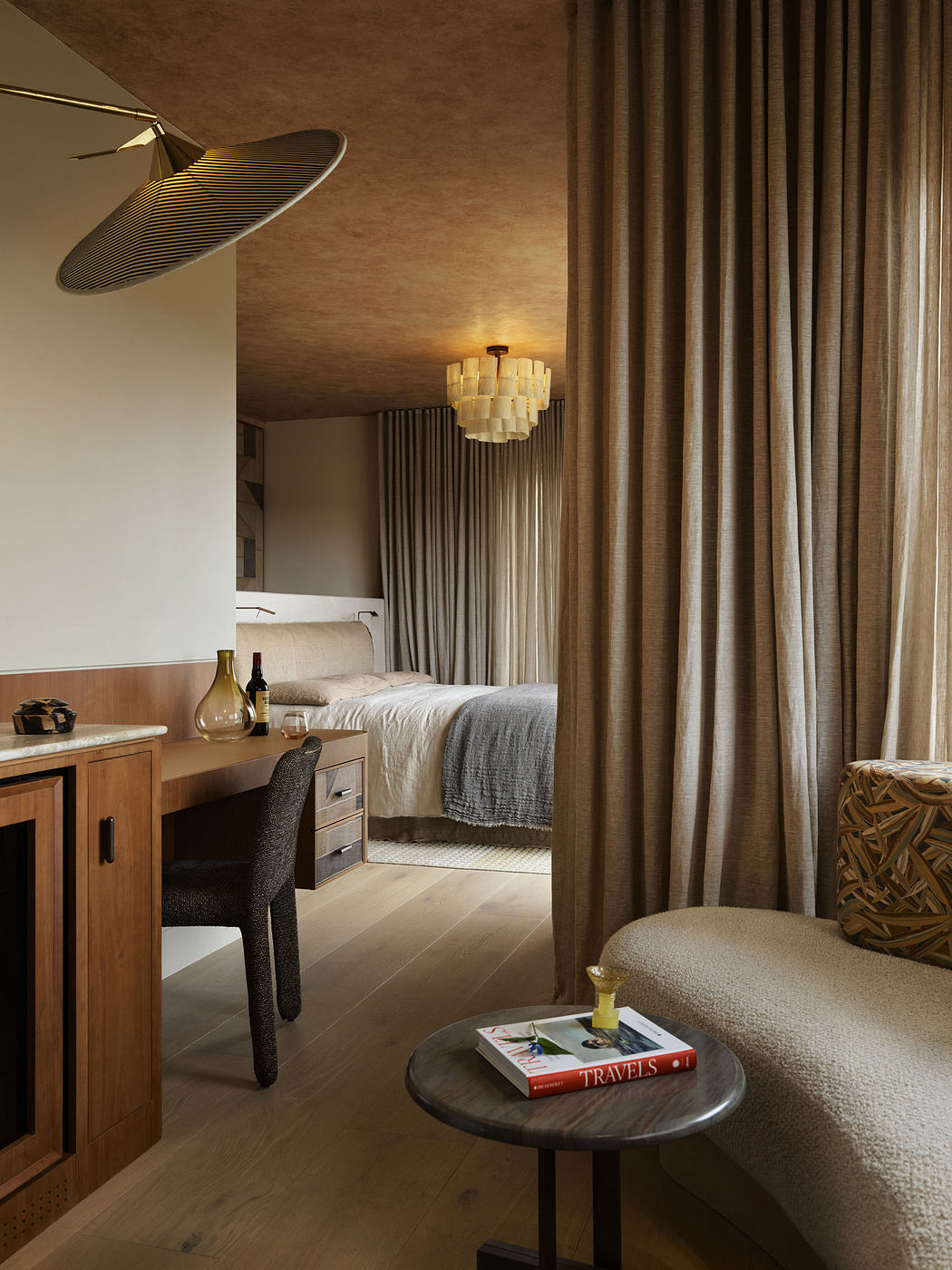 Cozy bedroom interior with earthy tones and elegant decor.