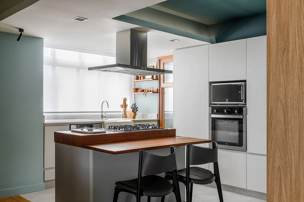 Modern kitchen with wooden countertops and built-in appliances.
