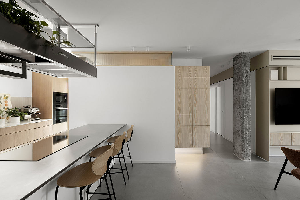 Modern kitchen with sleek design and minimalist furniture.