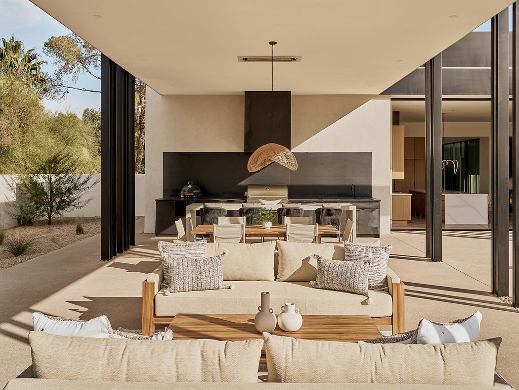 Modern outdoor living space with sleek furniture and open-plan design.