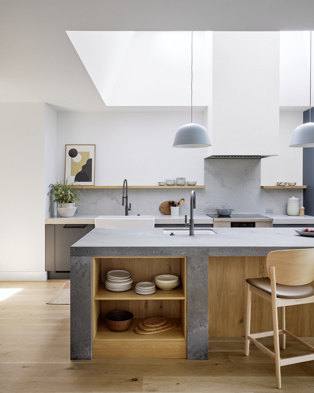 Modern kitchen with clean lines, pendant lights, and open shelving.