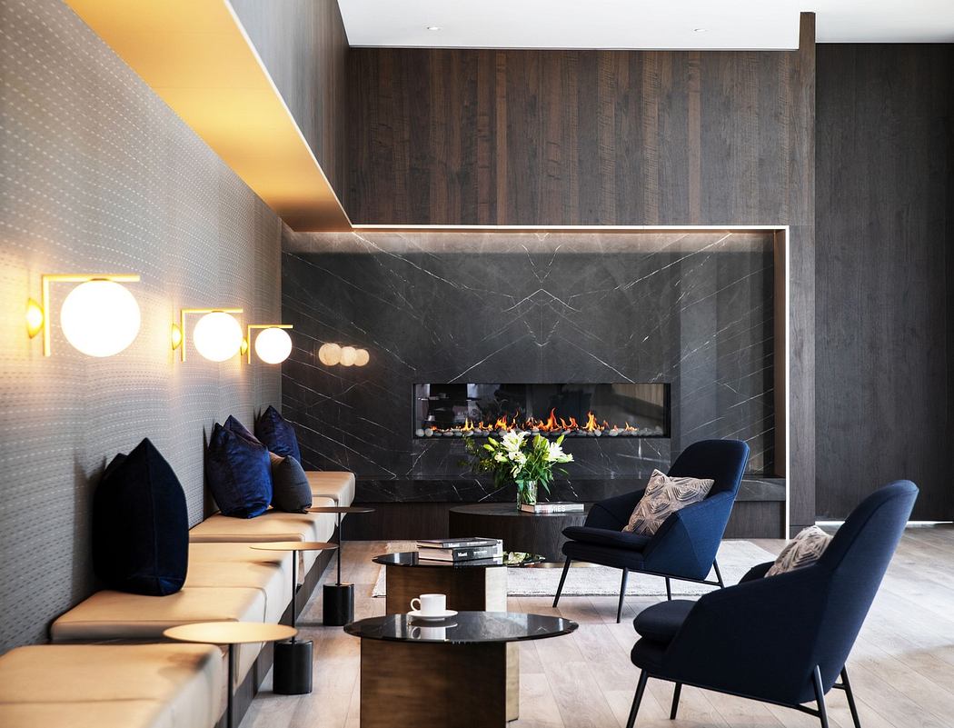 Modern living room with sleek fireplace, dark wood panels, and elegant furniture.