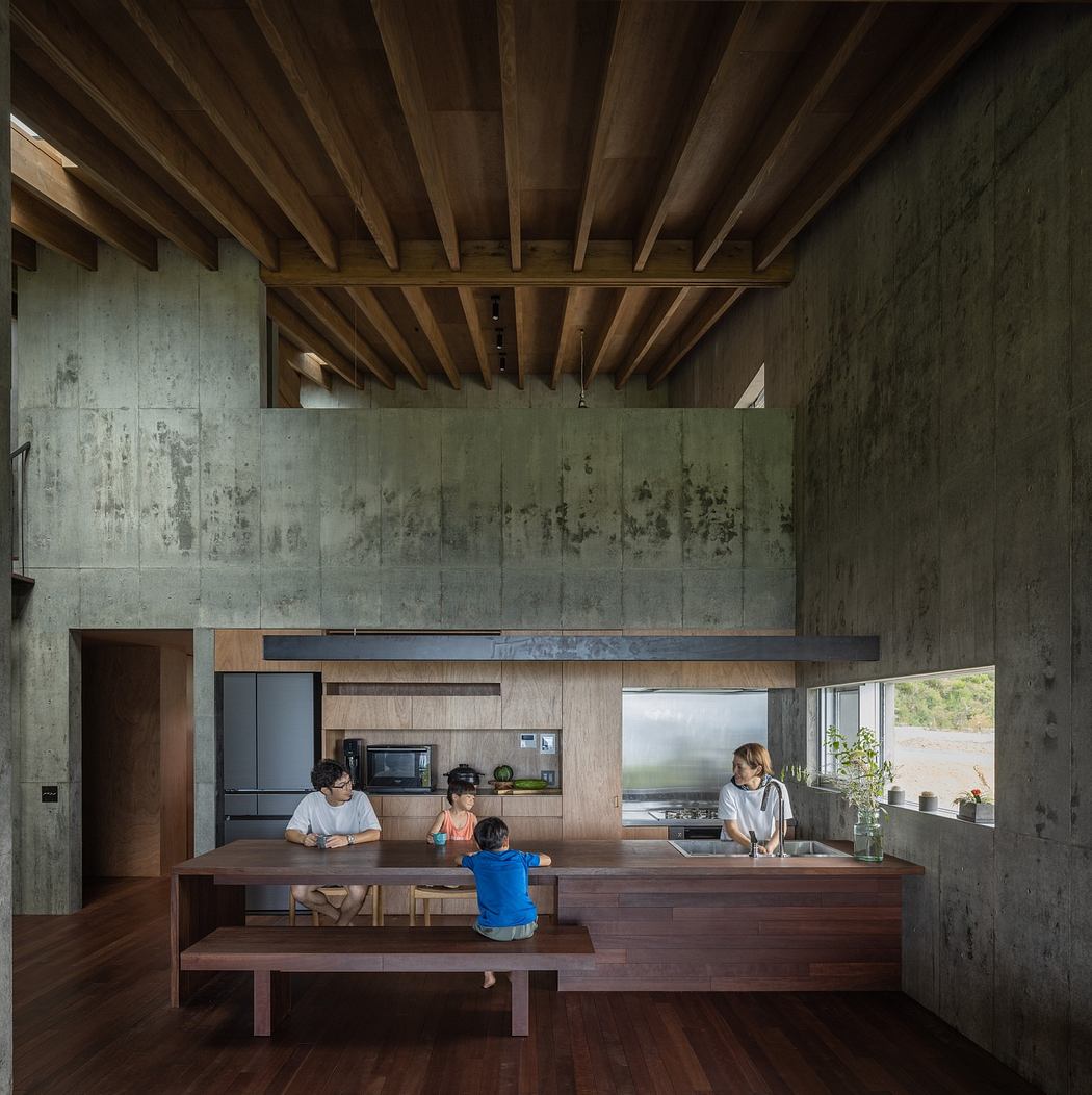 Modern open-plan kitchen with wooden ceiling, concrete walls, and a family at the