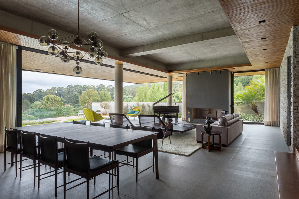 Modern open-plan living space with sleek furniture and expansive windows.