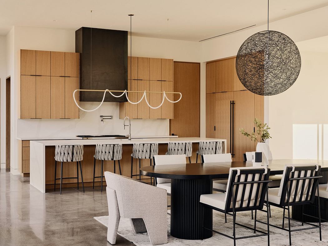 Modern kitchen interior with wooden cabinets and stylish pendant lighting.