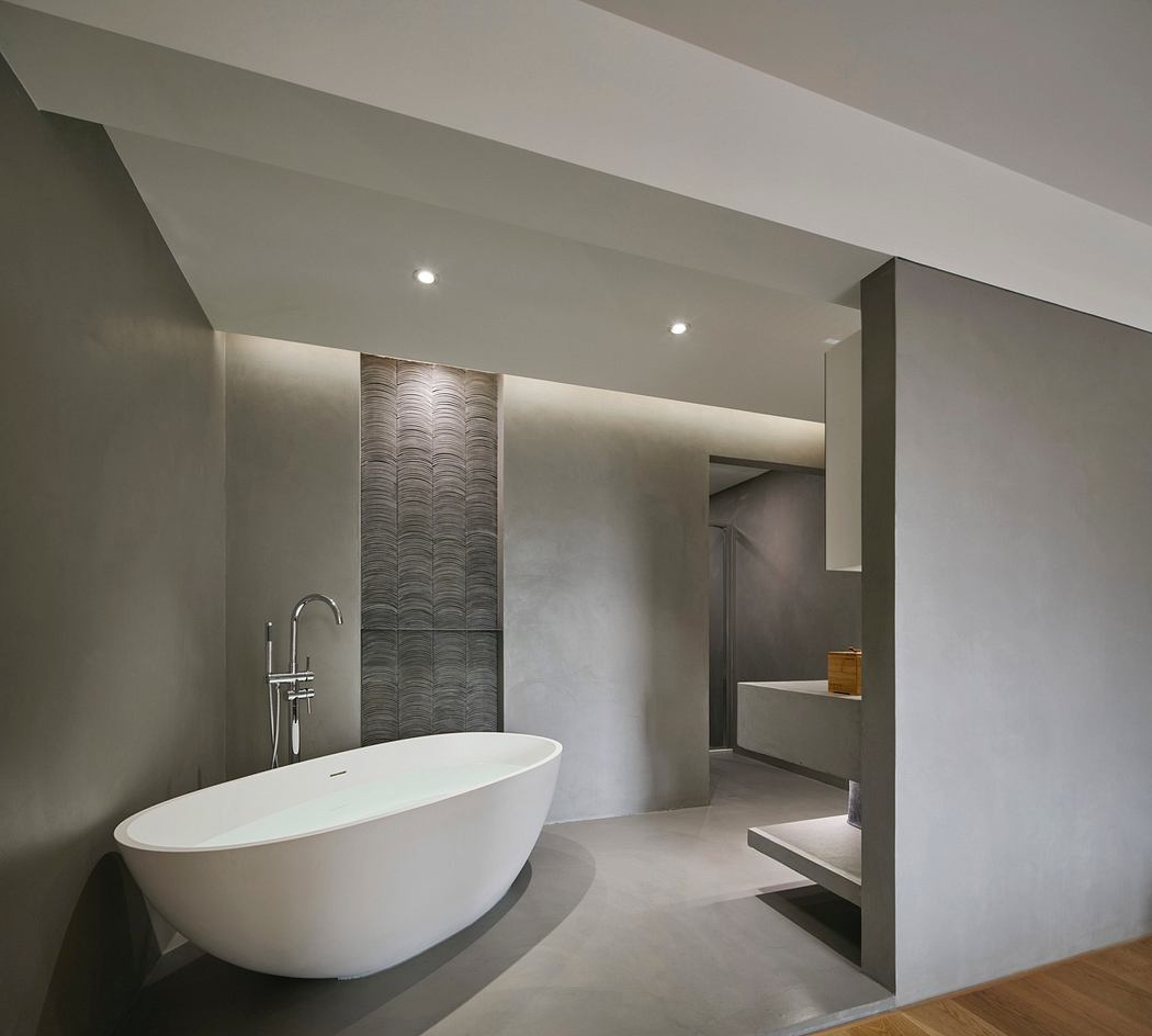 Modern bathroom with a freestanding tub and minimalistic design.