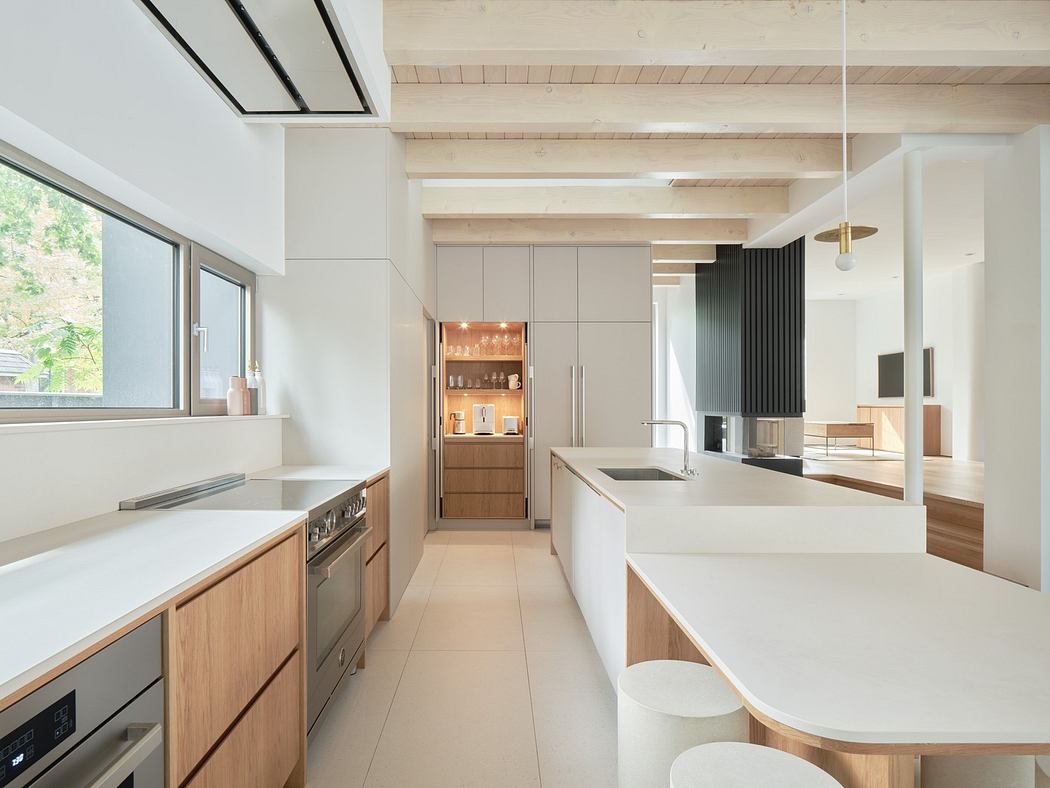Modern kitchen with sleek wooden cabinets and white countertops.