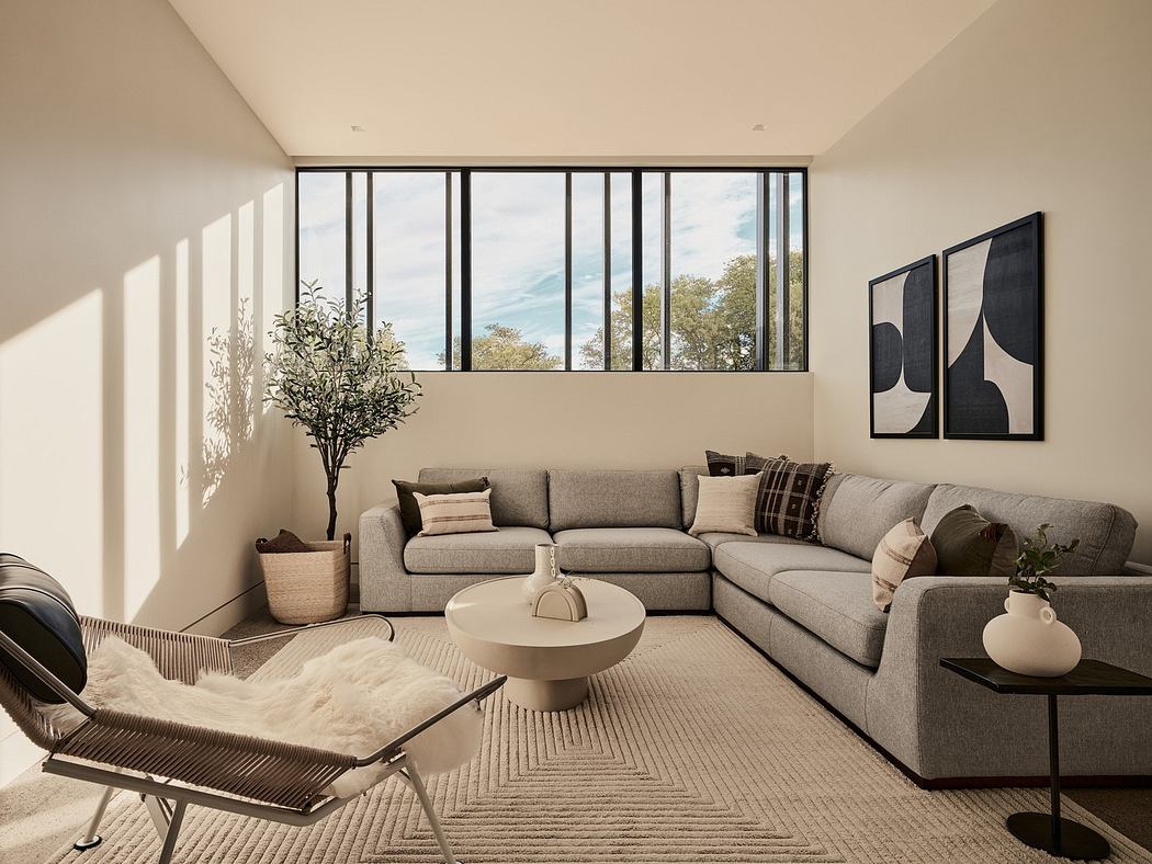 Modern living room with large windows, sectional sofa, and minimalist decor.