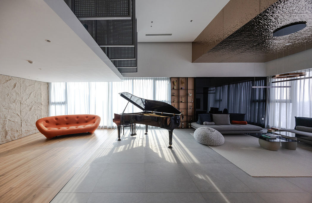 Modern living room with grand piano and minimalistic furniture.