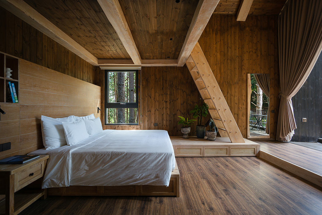 Cozy wooden bedroom interior with large bed, stairs, and window view.