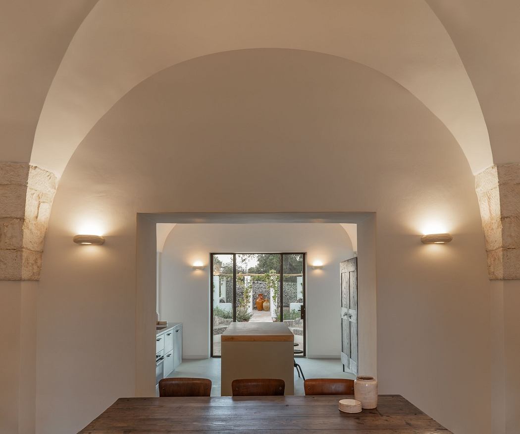 Minimalistic interior with arched ceiling and warm lighting.