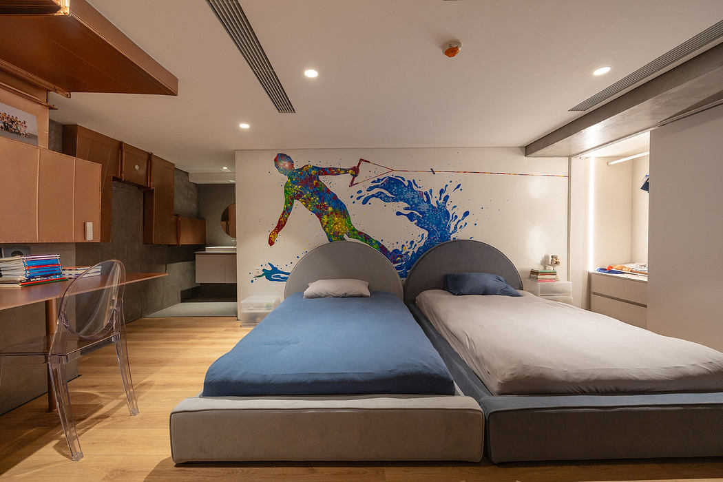 Modern bedroom with two beds and vibrant wall art.