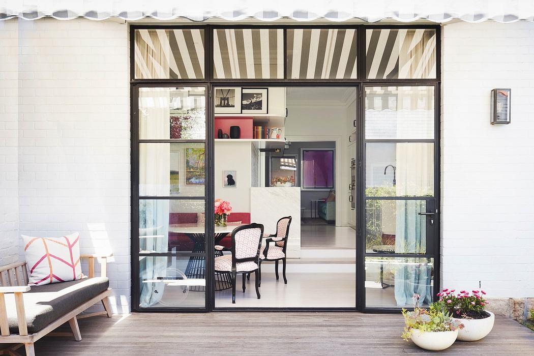 Modern patio with sliding glass doors and stylish interior.
