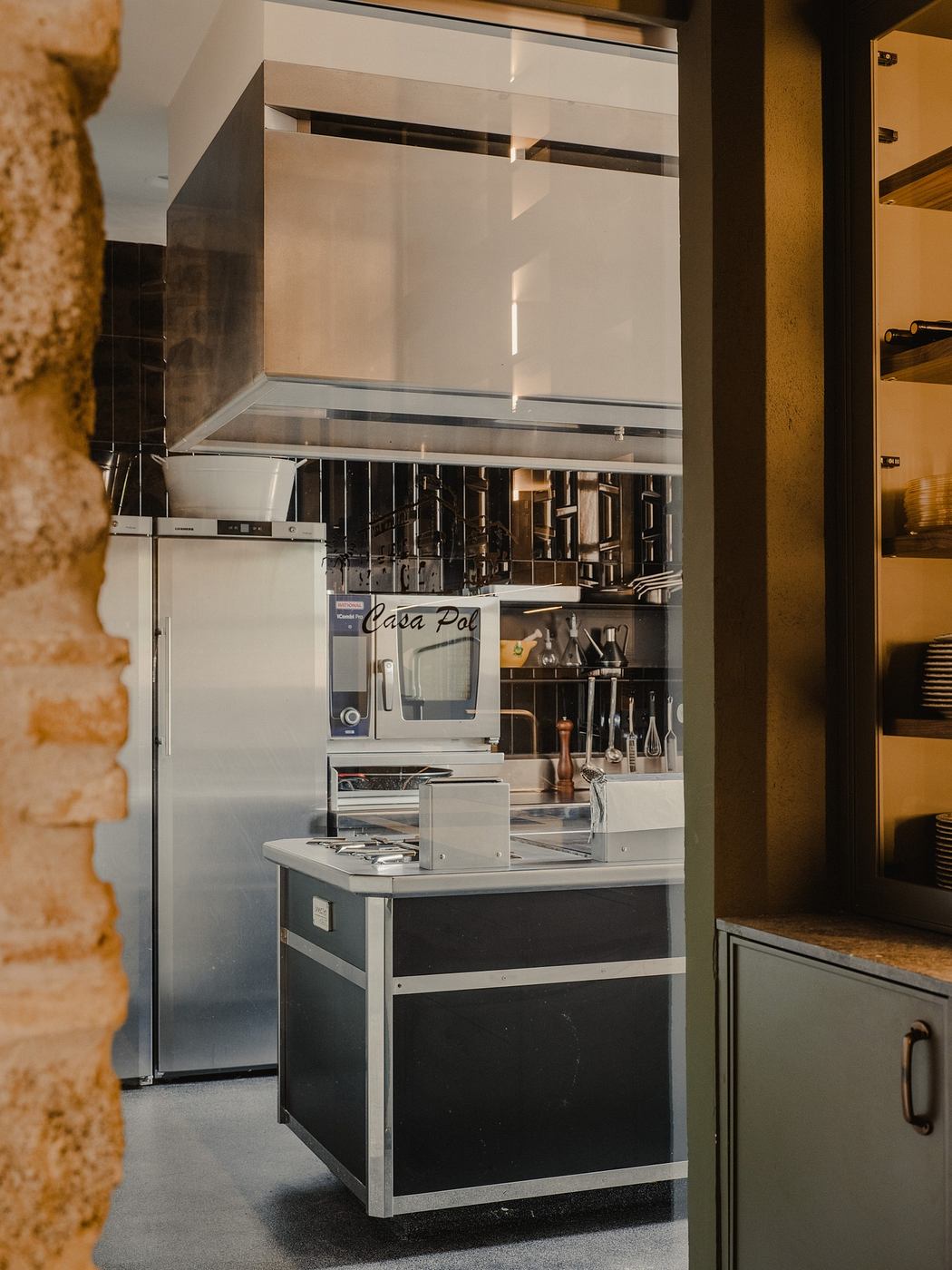 Modern kitchen interior with stainless steel appliances and minimalist design.