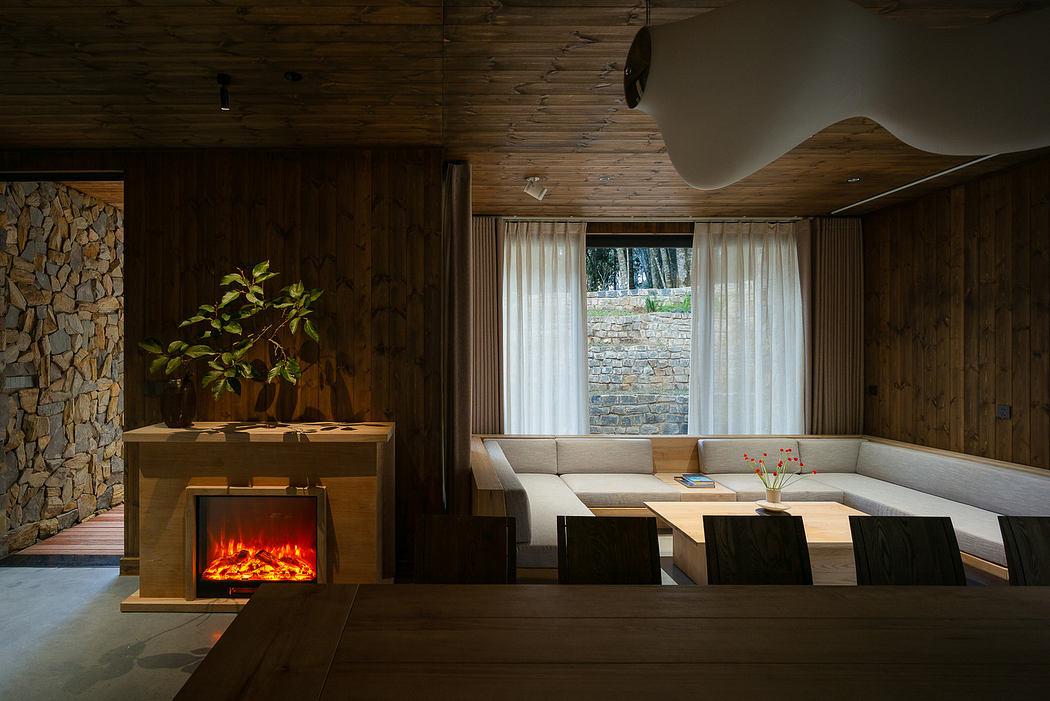 Modern wooden living room with fireplace, built-in seating, and large window.