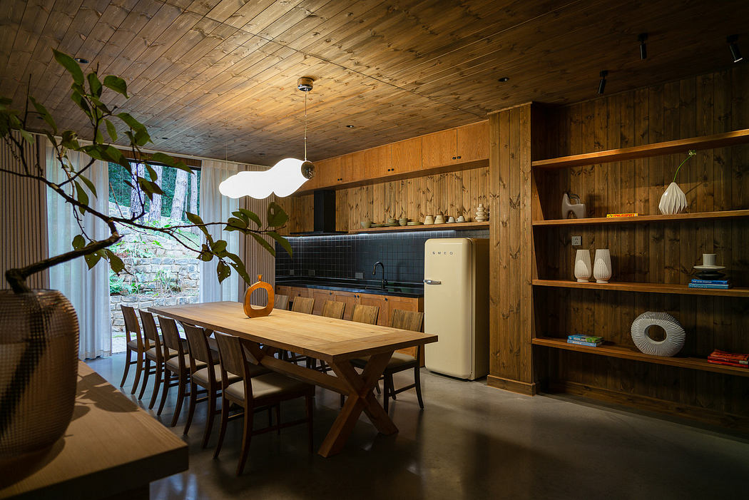 Modern dining room with wooden furniture and shelving, pendant light, and large window