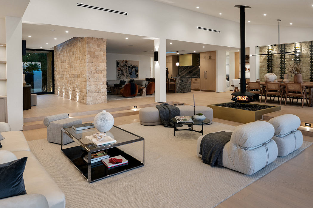 Modern spacious living room with elegant furniture and fireplace.