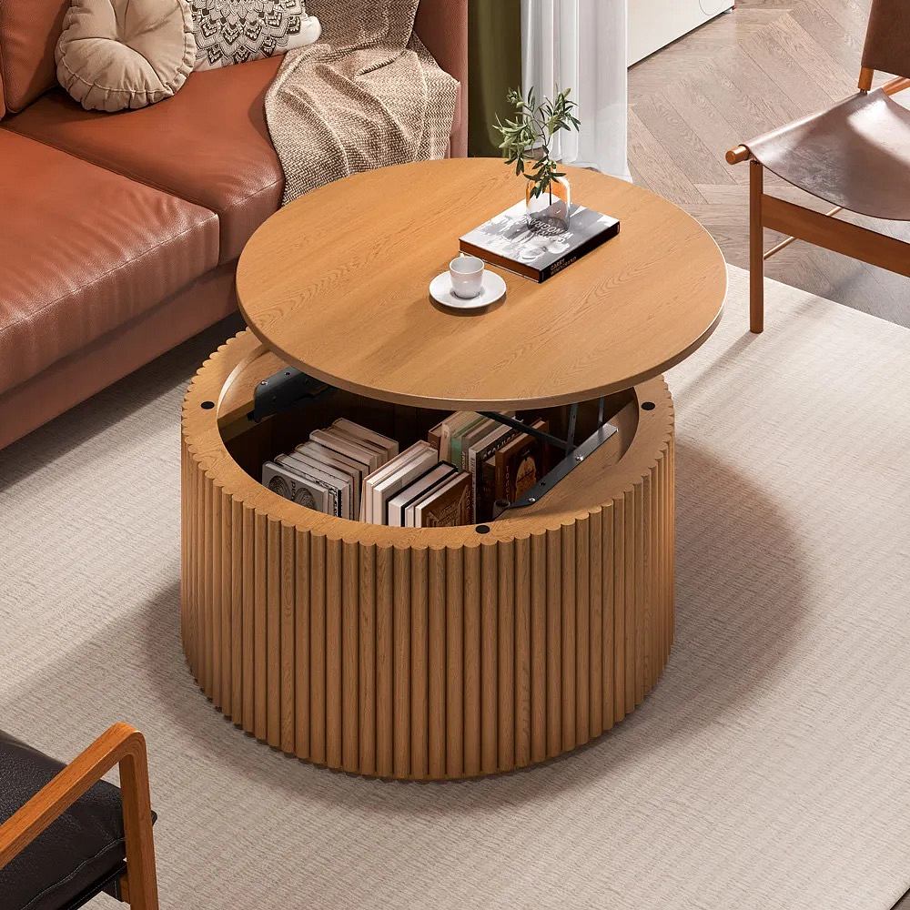 Modern living room with a round wooden coffee table with book storage.