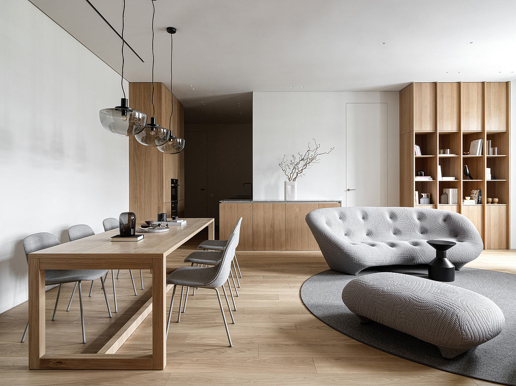 Modern dining and living room with wood furniture and neutral tones.