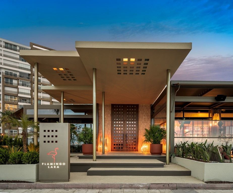 Contemporary entrance with sleek canopy and warm lighting