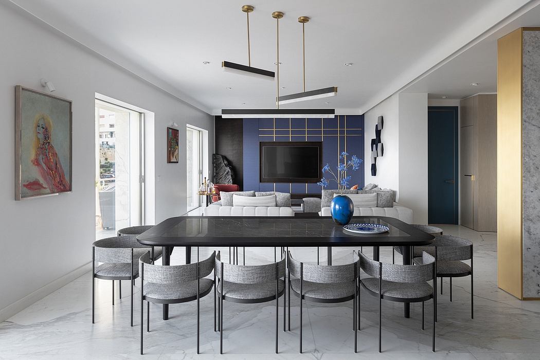 Modern living room with large dining table, sofa, and blue accent wall.