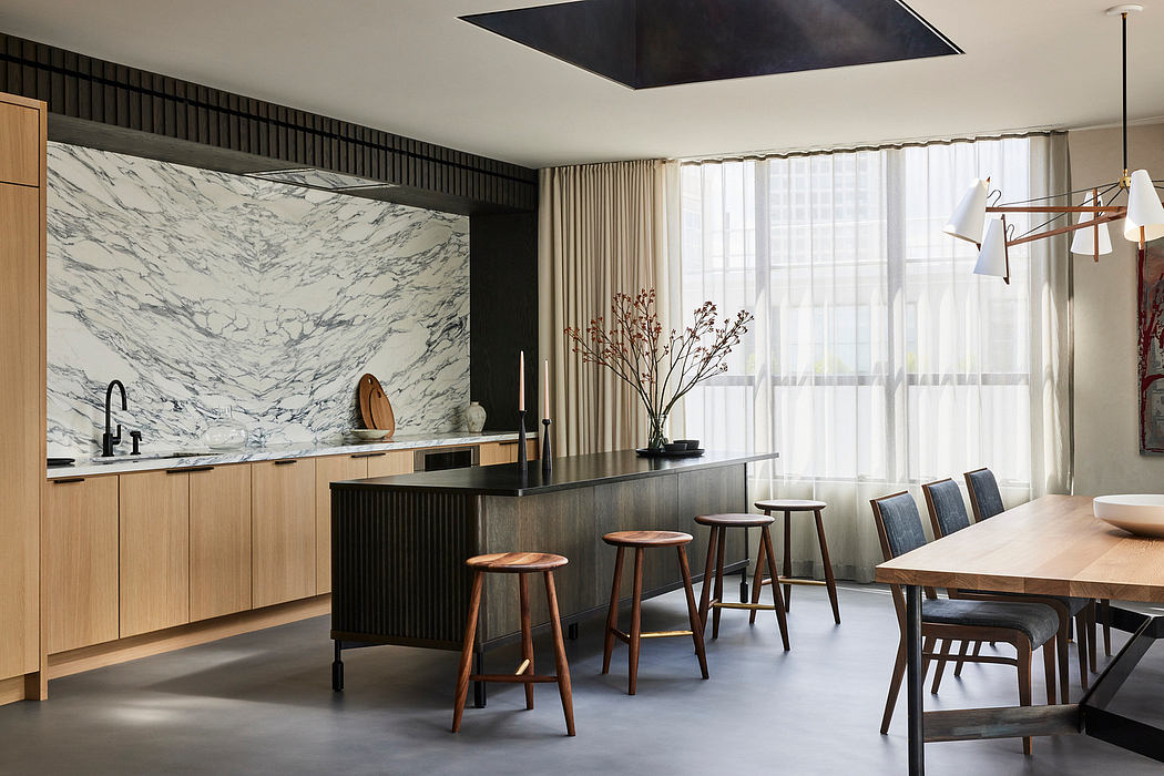 Modern kitchen with marble backsplash, wooden accents, and dining area