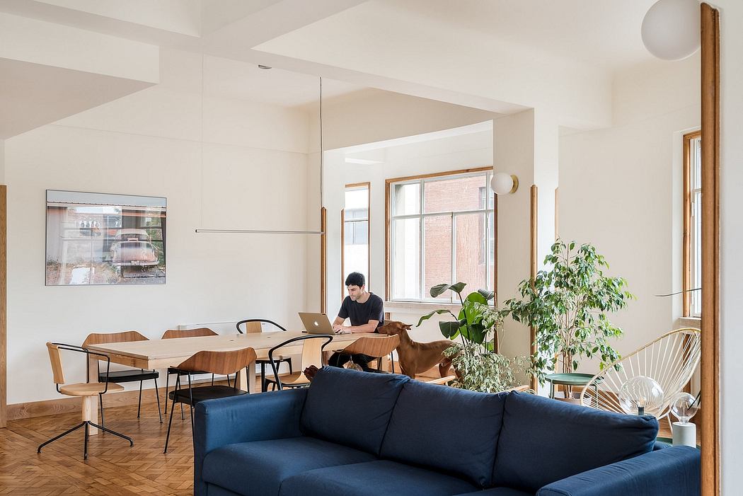 Contemporary, open-plan living space with minimalist decor and natural light.
