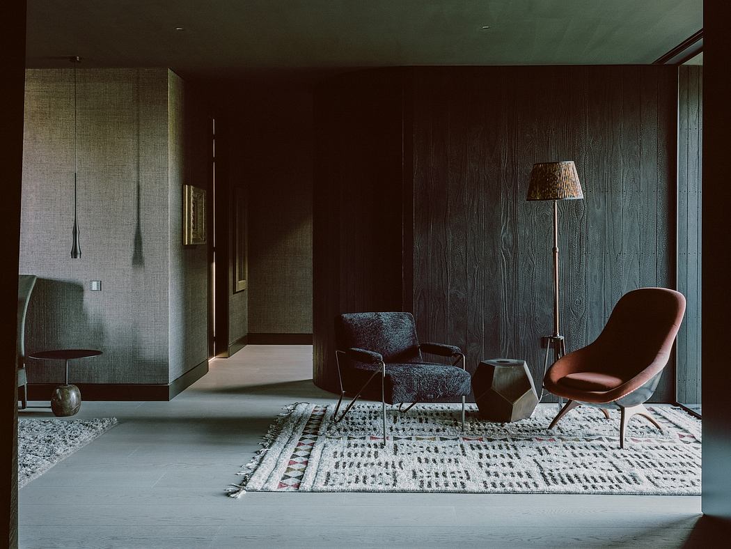 Contemporary room with dark wood walls, designer furniture, and elegant decor.