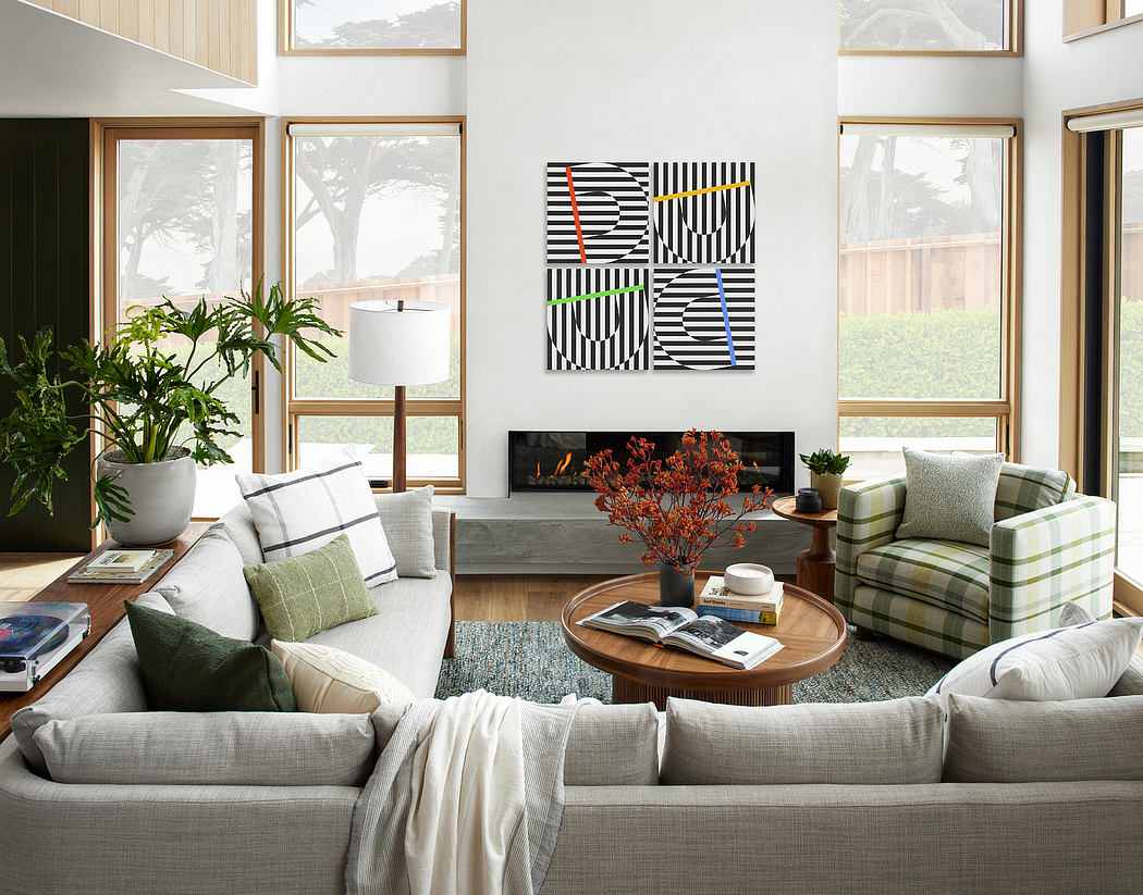 Contemporary living room with large windows and a geometric wall art piece.