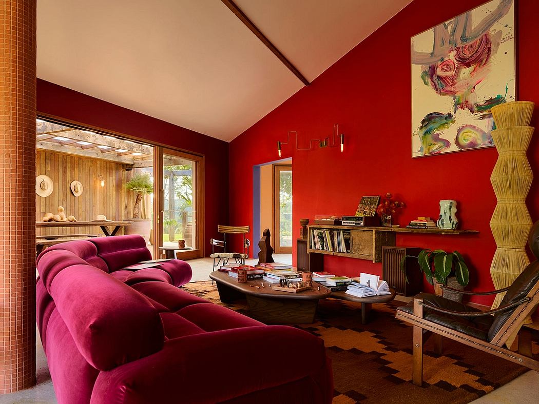 Vibrant red-walled room with plush sofa and eclectic decor.