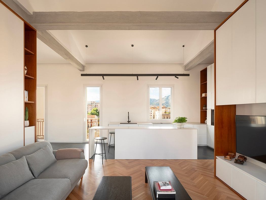 Contemporary living space with minimalist design and exposed ceiling beams.