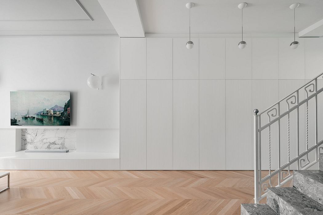 Minimalist interior with white walls, herringbone floor, and a staircase.