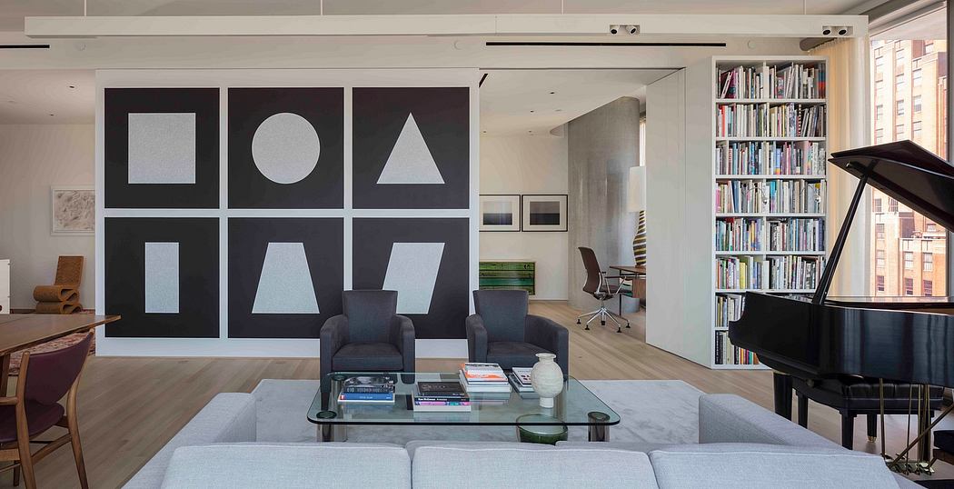 Contemporary living room with geometric art, grand piano, and bookshelf.