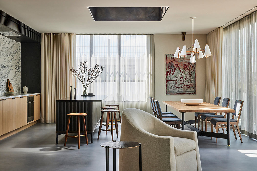 Contemporary dining room with neutral tones and artistic touches.
