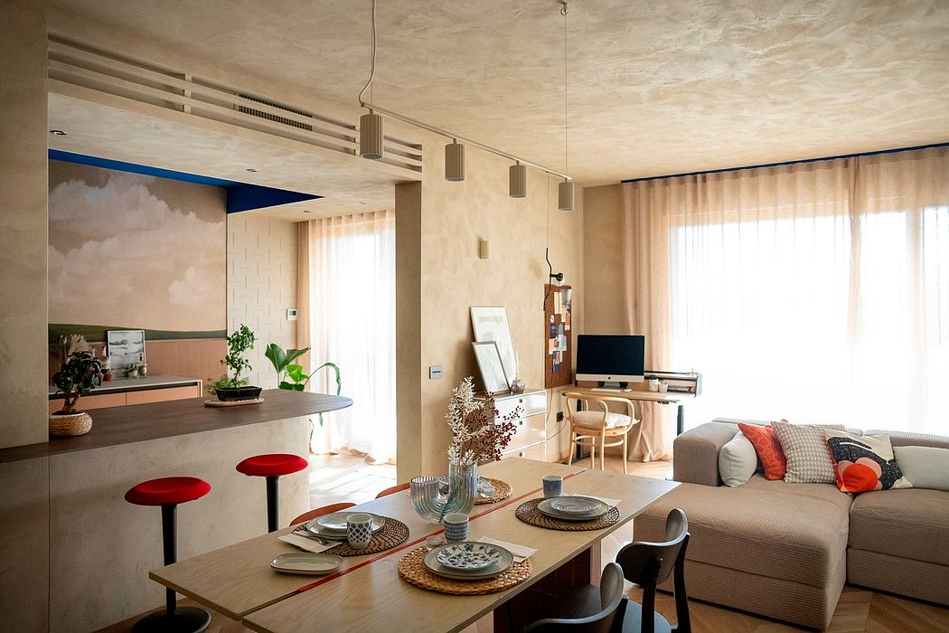 Modern living room with dining area, neutral tones, and natural light.