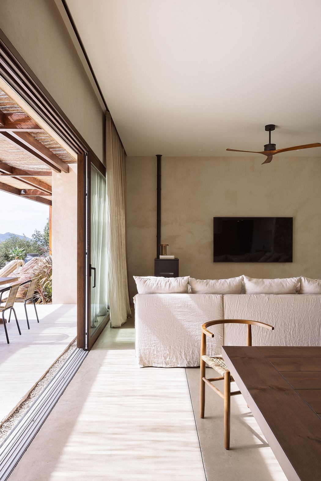 Contemporary bedroom with neutral tones and sliding glass door