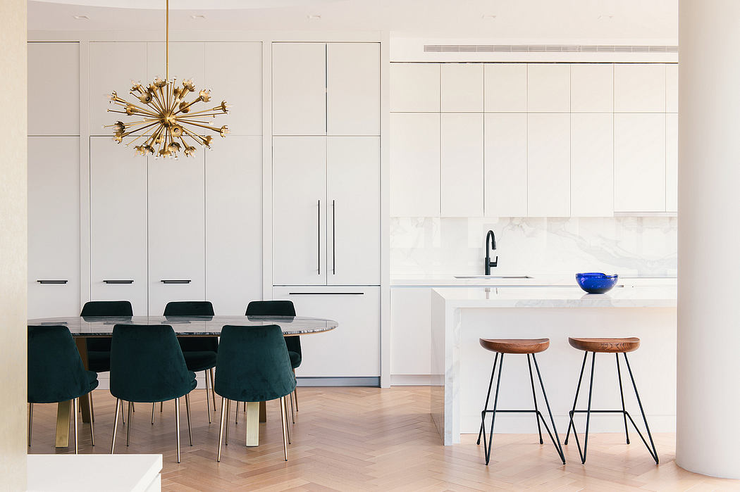 Sleek kitchen interior with minimalist cabinetry and chic pendant light.
