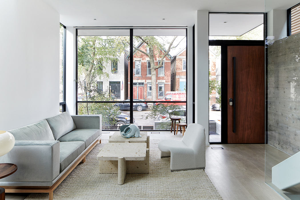 Modern living room with large windows and minimalist decor.
