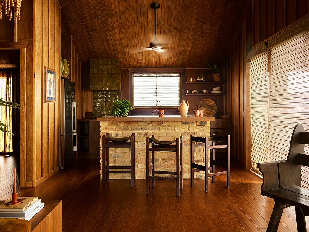 Wood-paneled kitchen with stone bar and bamboo blinds.