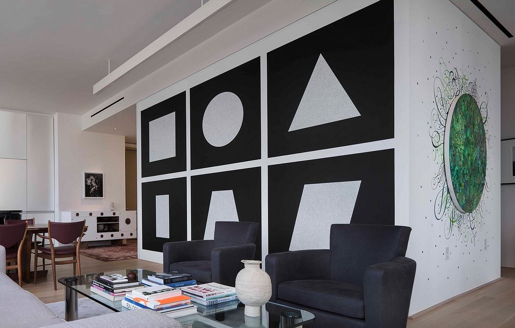Contemporary living room with geometric wall art and minimalist design.