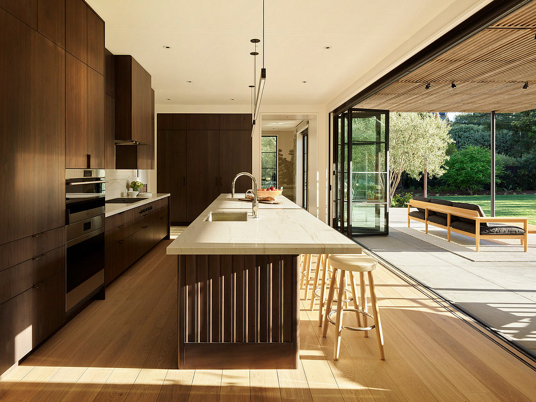 Contemporary kitchen with sleek dark cabinets and large island.
