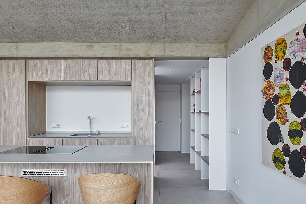 Modern kitchen with wooden cabinets and exposed concrete ceiling.